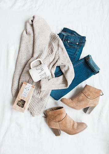 clothes gray cardigan, blue jeans, and pair of brown chunky heeled shoes clothing