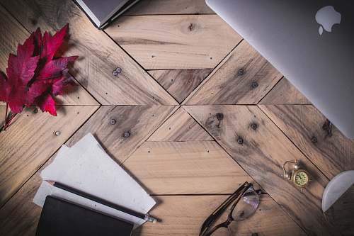 table clear eyeglasses with black frames on brown parquet floor glasses