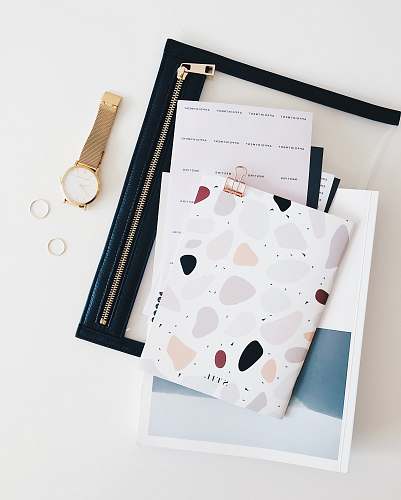 layout round gold-colored analog watch with link bracelet flatlay layour