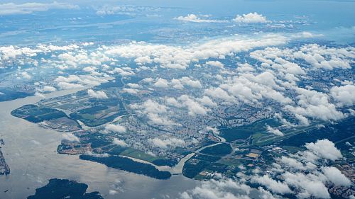 aerial view of land below the clouds