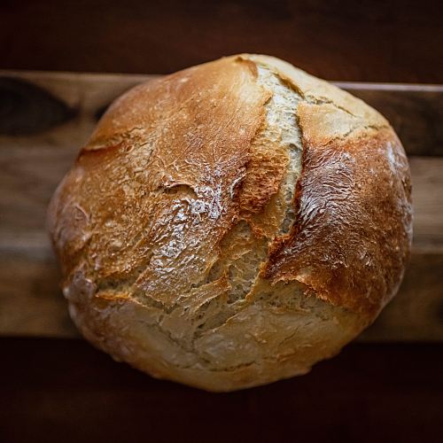 baked bread on wooden tray