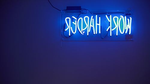 blue Work Harder neon signage