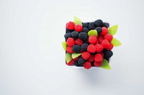 bowl of red and black berries