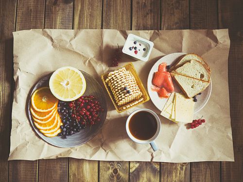 bread and fruits on plate