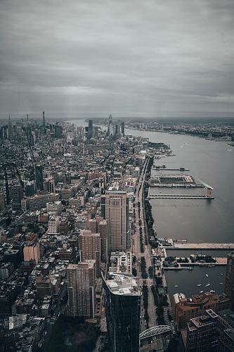 building lot near body of water during daytime aerial view photography