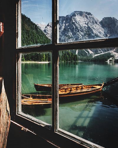 four brown wooden boat near dock