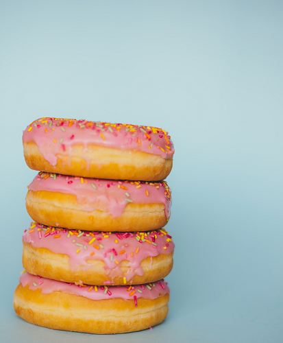 four donuts with sprinkles