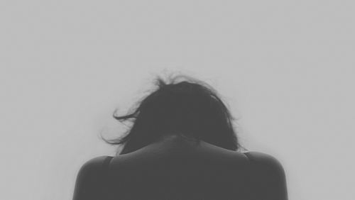 grayscale photo of person's back