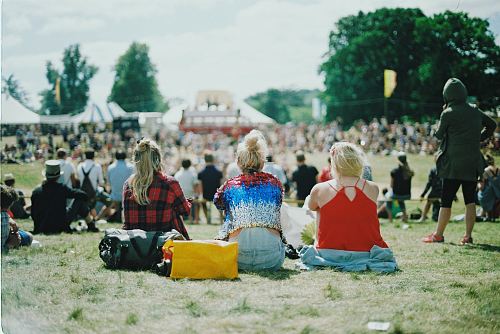 group of people on grass field under sunny day