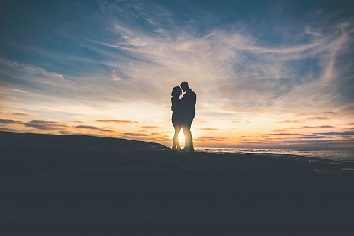 man and woman hugging each other