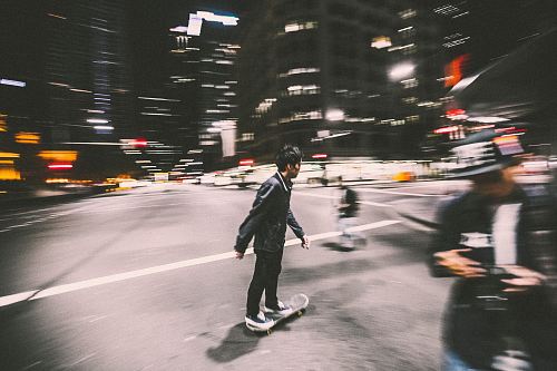 man riding on skateboard on street