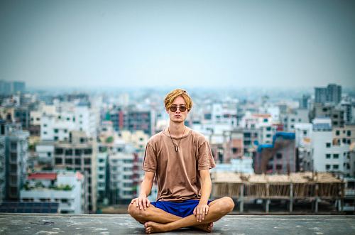 man sitting at the top of the building