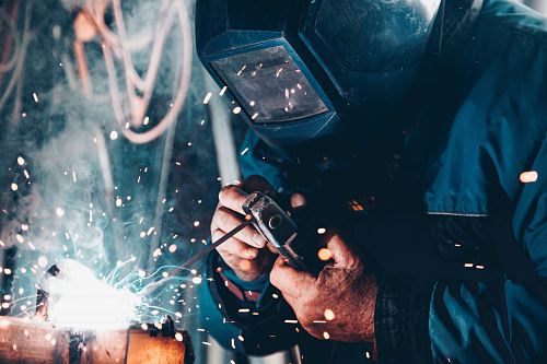 man using welding machine