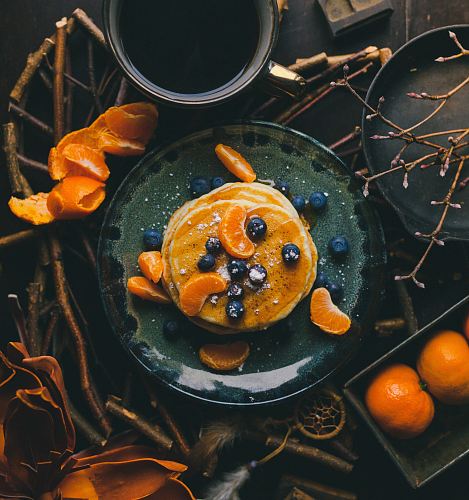 pancakes with orange and blueberry on plate