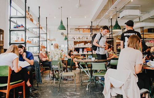 people eating inside of cafeteria during daytime