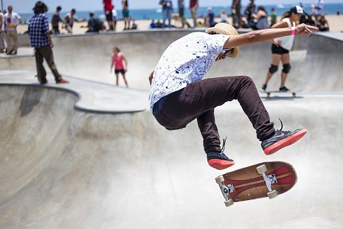 people playing skateboard on skateboard park