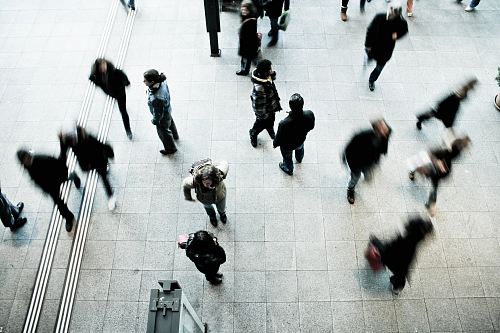 people walking on grey concrete floor during daytime