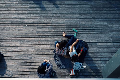 person laying on wooden flooring