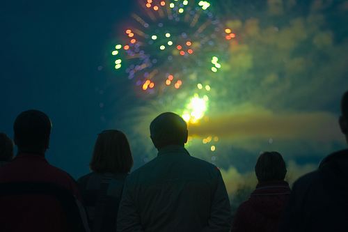 photo of people looking in fireworks