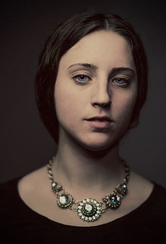 portrait photography of woman in black top