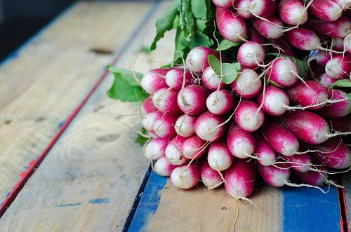 purple and white vegetables on brown surface