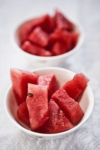 shallow focus photography of bowl of watermelon