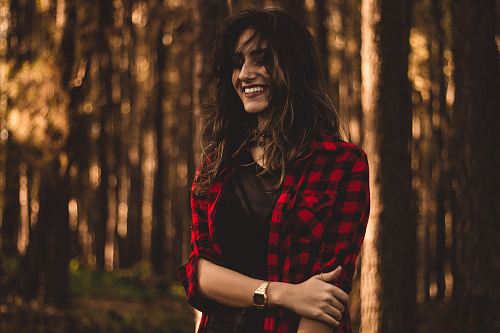 shallow focus photography of woman in red checkered button-up top