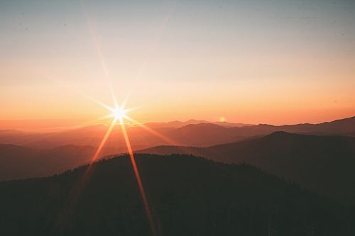 silhoutte of mountains during sunset