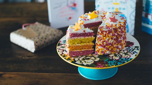 sliced cake on cake riser
