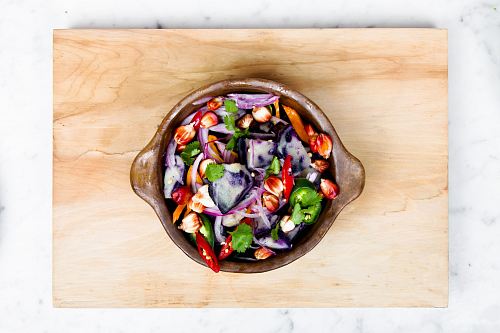 sliced onions and bell pepper in a bowl