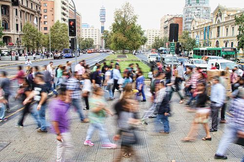 timelapse photo of people passing the street