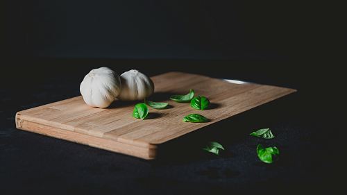 two bulb of garlic on top of chopping board