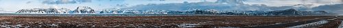 vast field with mountain ranges