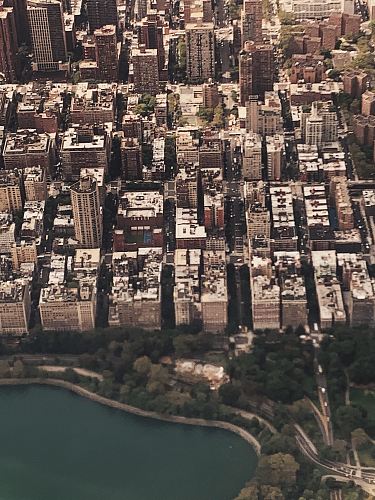 white and black concrete buildings high-angle photography