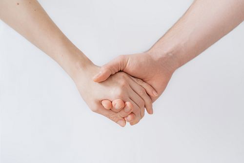woman and man holding hands
