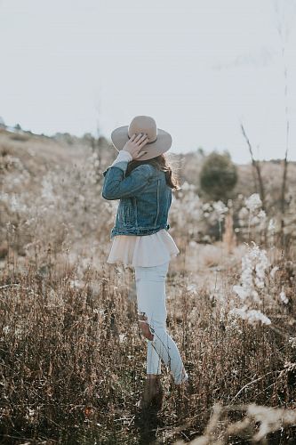 woman facing hill during daytime