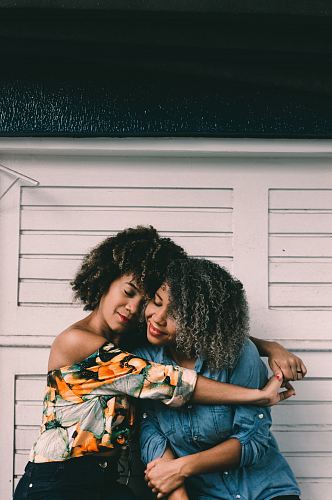 woman hug each other