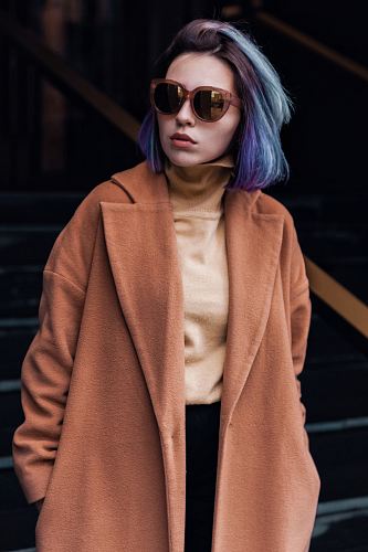 woman in pink coat standing