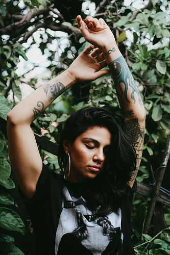 woman raising her both hands