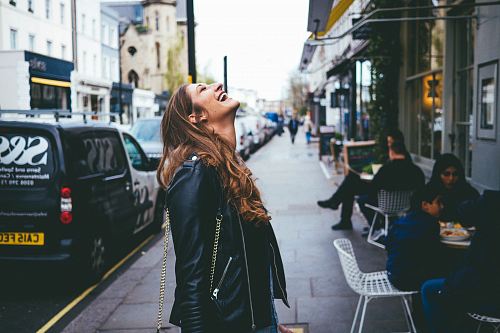 woman smiling looking at the skies
