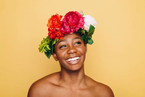woman smiling wearing flower crown