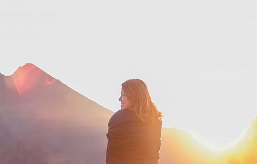 woman standing near mountain during daytime