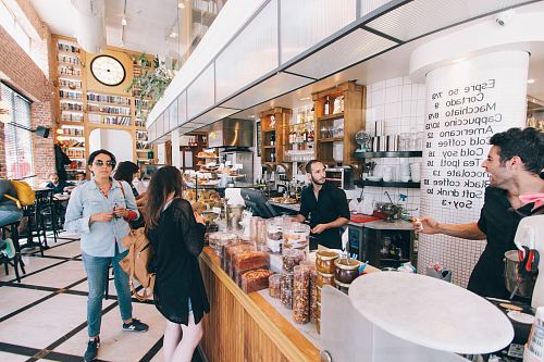 woman standing on food counter