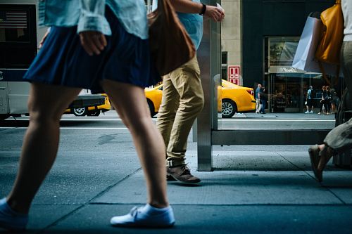 woman walking on road sideways
