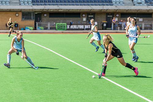 woman wearing black jersey playing on field