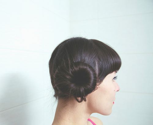 woman with straight black hair bun