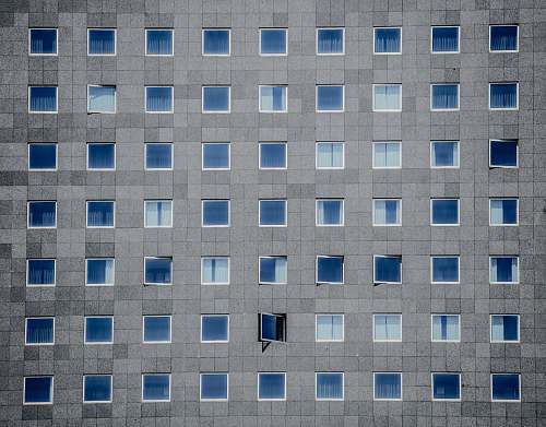 building gray concrete building photography pattern