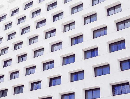 building white concrete building windows