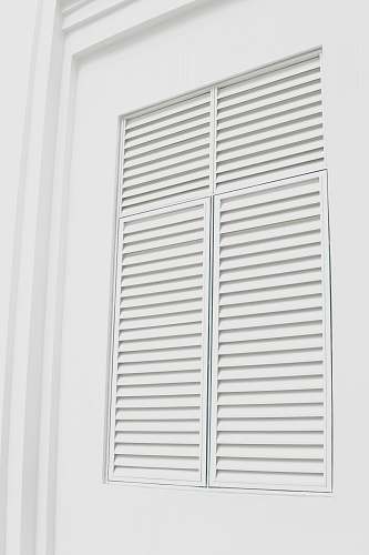 white white wooden louvered door grey