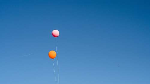 balloon two orange and pink balloons string
